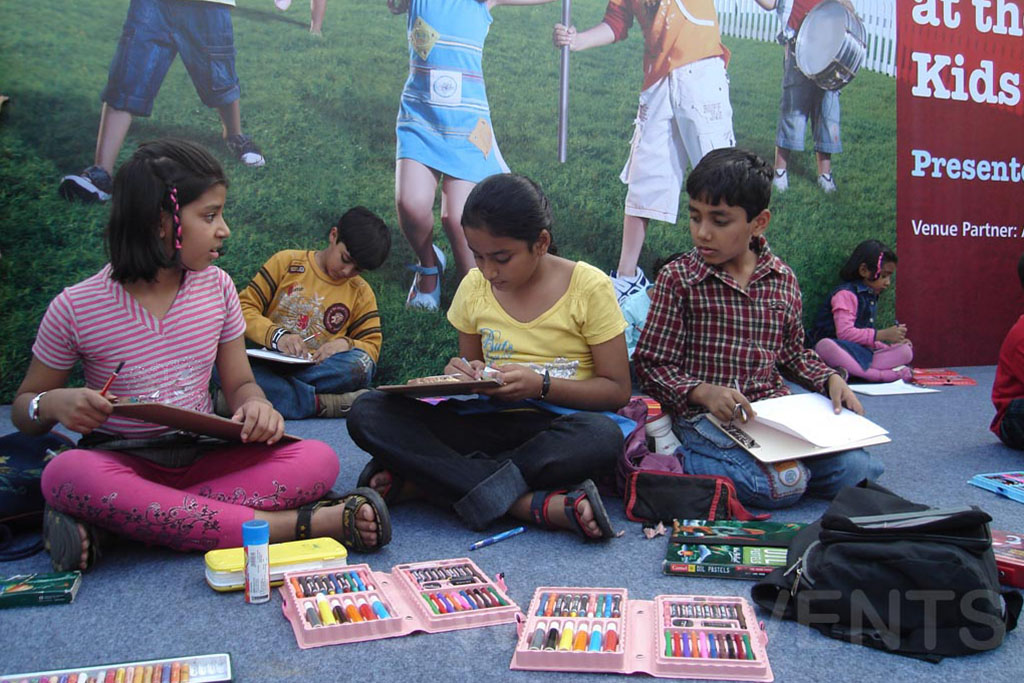 Children doing craft activities on a lawn