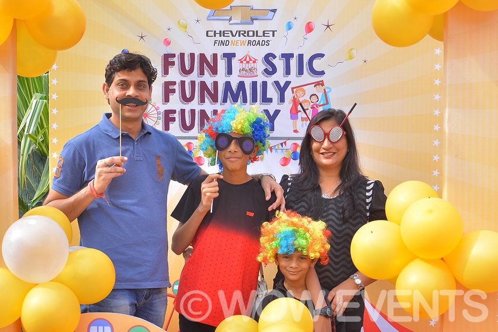 Family posing with balloons at the Chevrolet Funtastic Family Funday