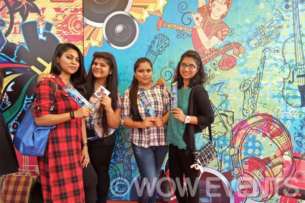 Students taking a group selfie at the Comio activation