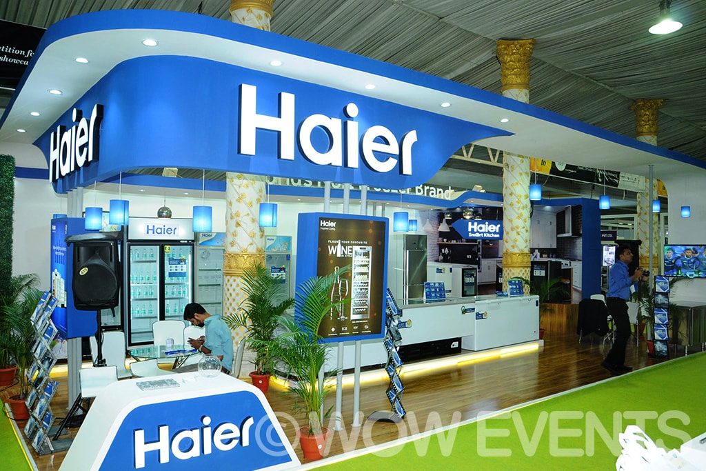 Haier experience zone stall with a curved logo wall