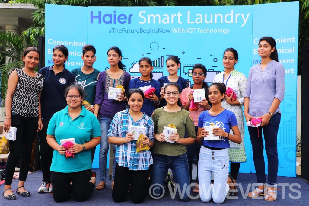 Students group photo at the Haier Smart Laundry booth