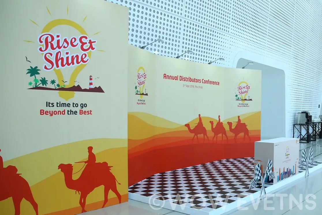 Rise and Shine conference booth with camel graphics