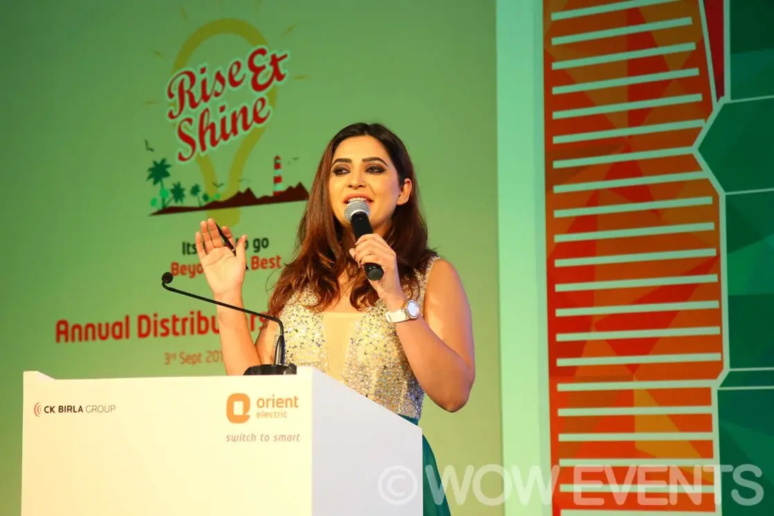 Host speaking at the Orient Rise and Shine conference