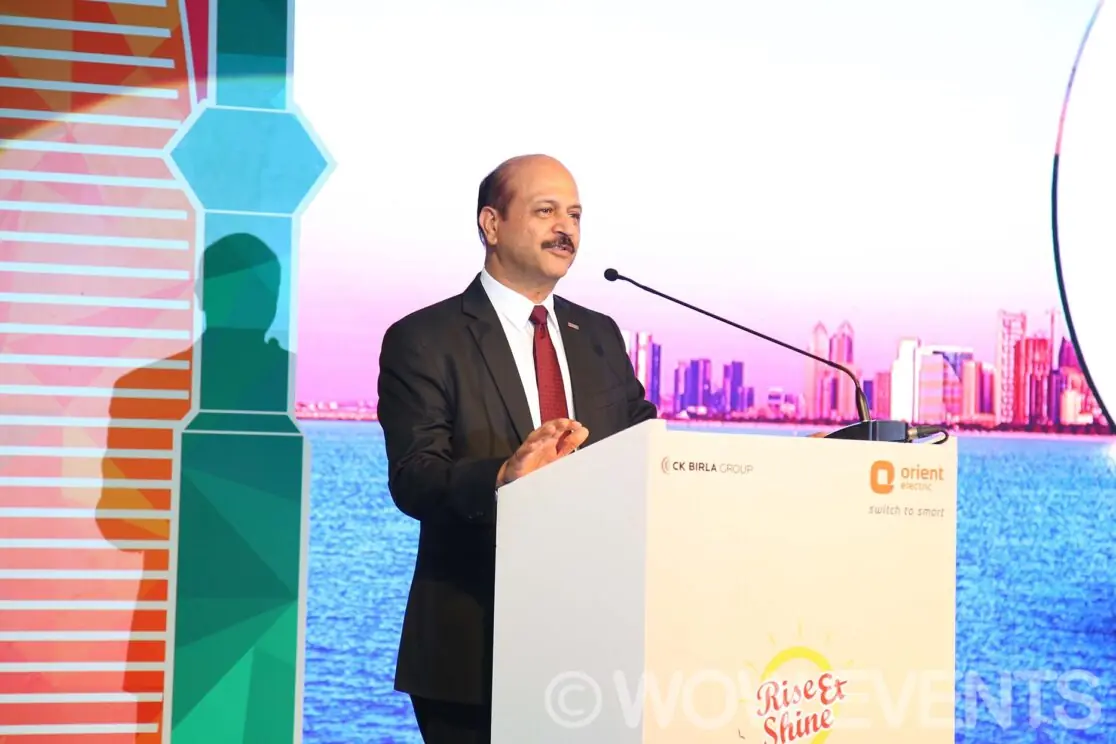 Orient executive speaking at a podium