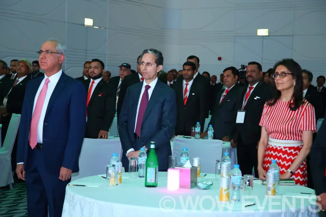 Guests standing at tables at the Orient Lighting conference