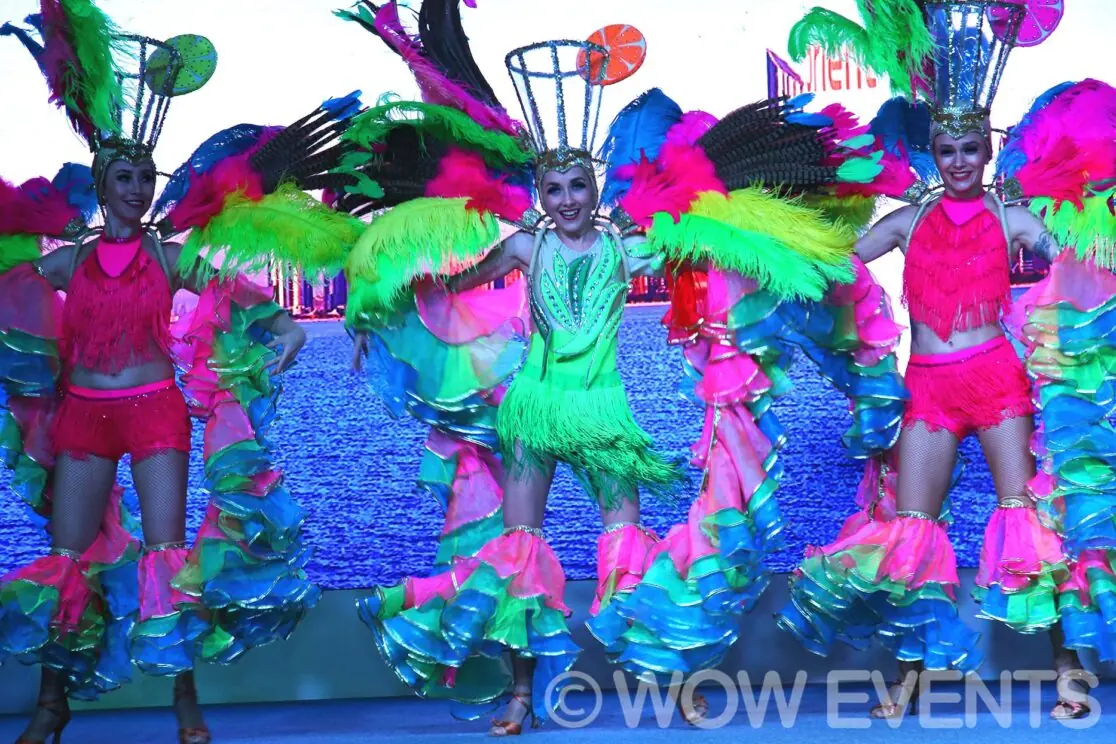 Performers in carnival costumes on stage