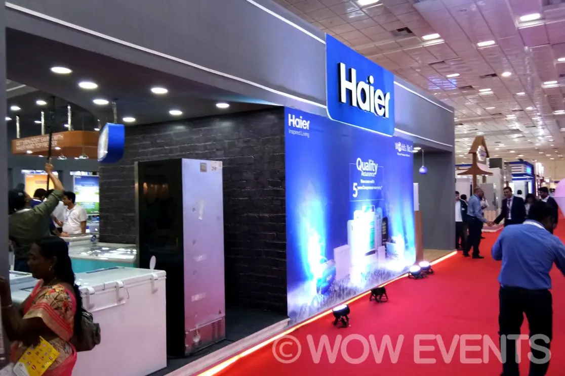 Haier stall with red carpet and display panels
