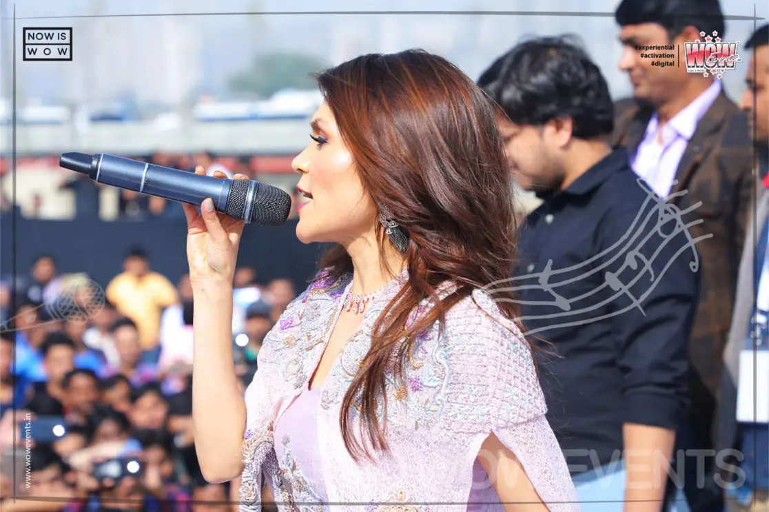 Samsung annual day host singing in front of the crowd