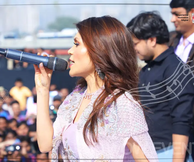 Samsung annual day host singing in front of the crowd