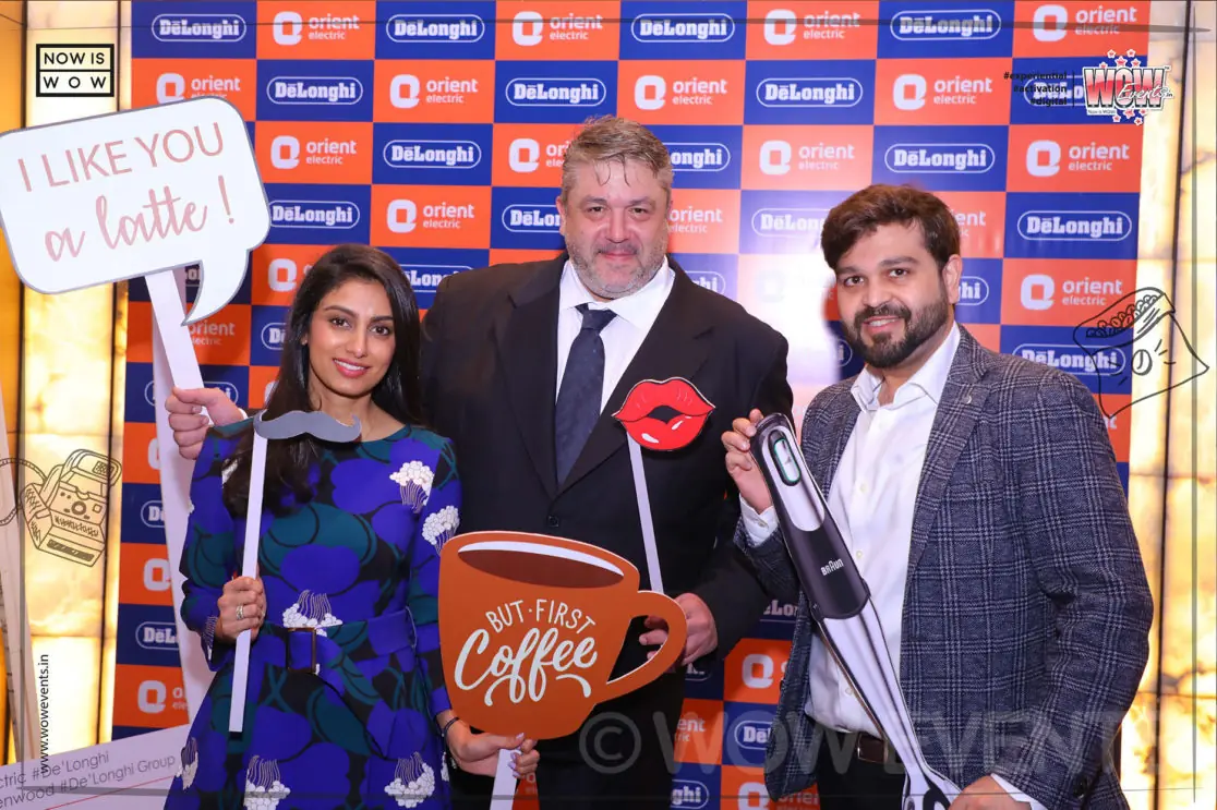 Guests with I Like Coffee props at the De'Longhi launch