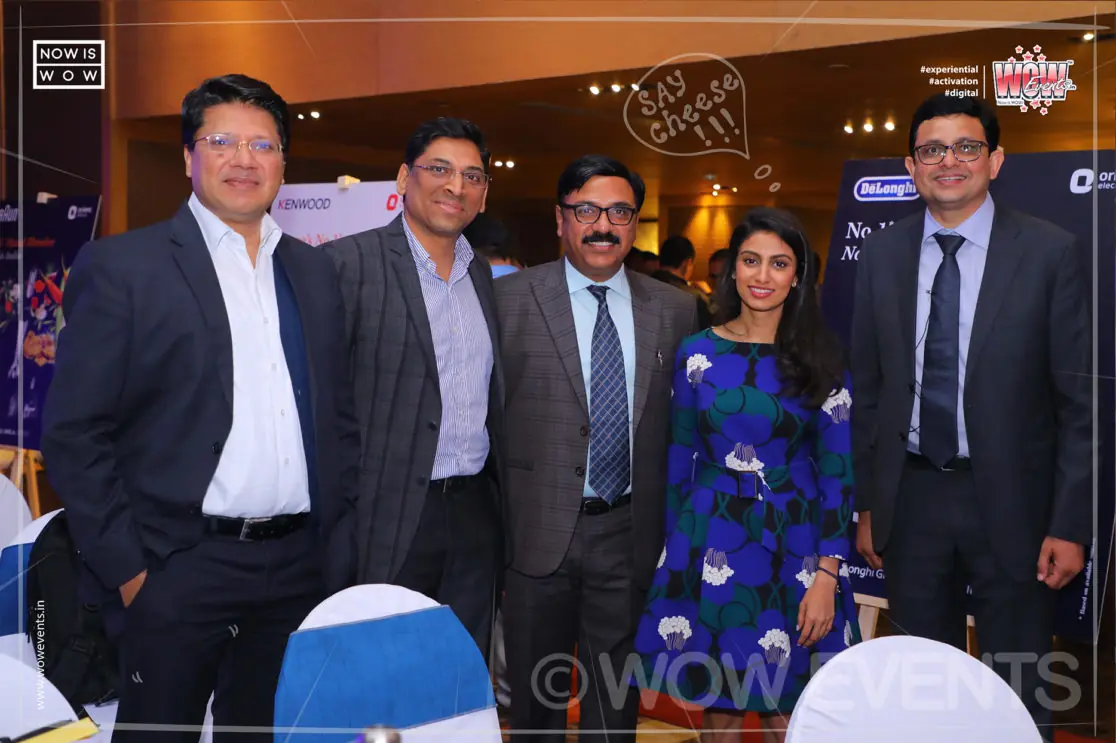 Executives posing at the De'Longhi launch event