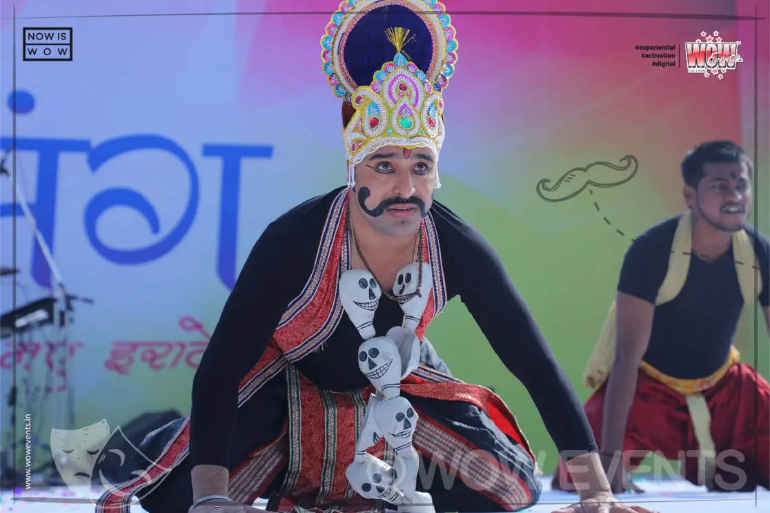 Performer in a demon costume on the Umang stage