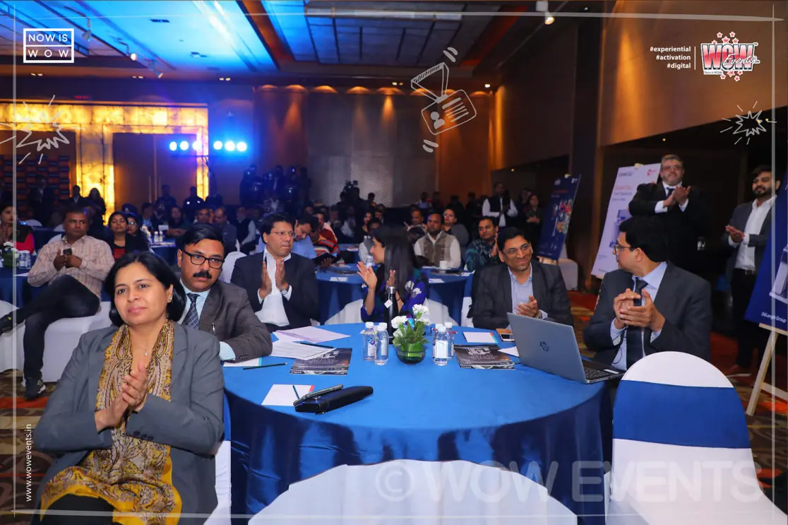 Guests seated at tables at the kitchen appliances launch