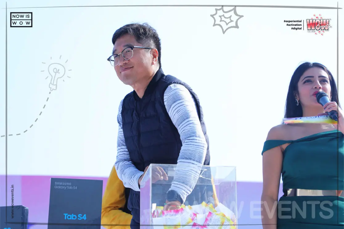 Samsung executive speaking on stage with the host