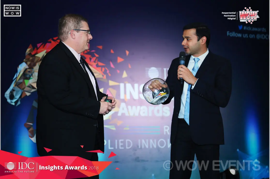 Two hosts on the IDC Insights Awards stage