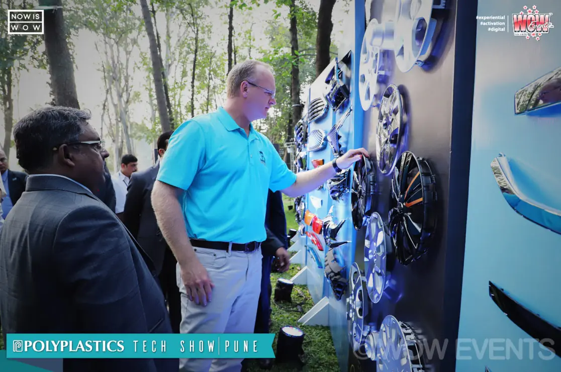 Visitor viewing displays at the Polyplastics tech show