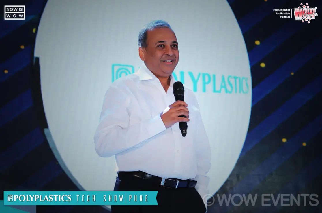 Polyplastics executive speaking with a microphone