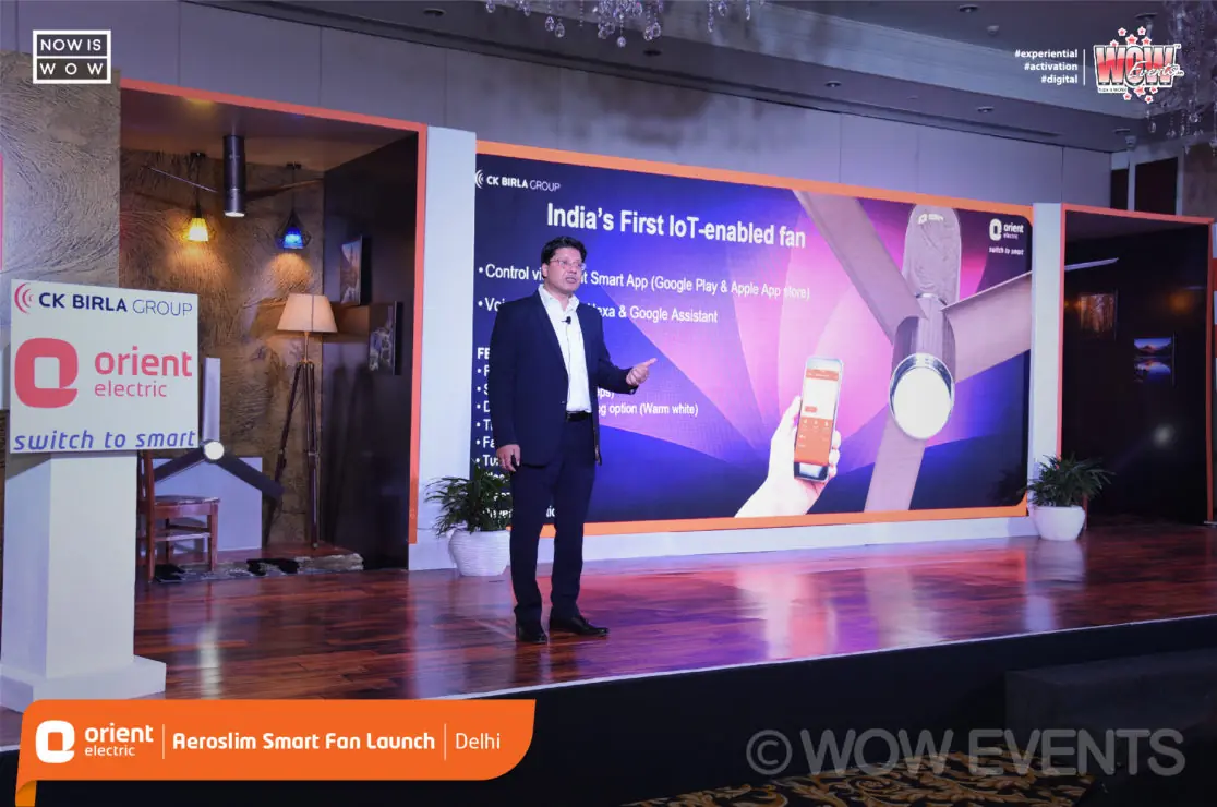 Speaker presenting on stage at the Orient Aeroslim launch