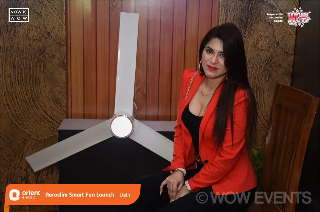 Model posing beside the Orient Aeroslim fan