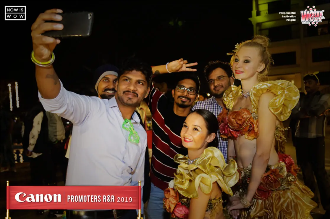 Guests taking a selfie with costumed performers