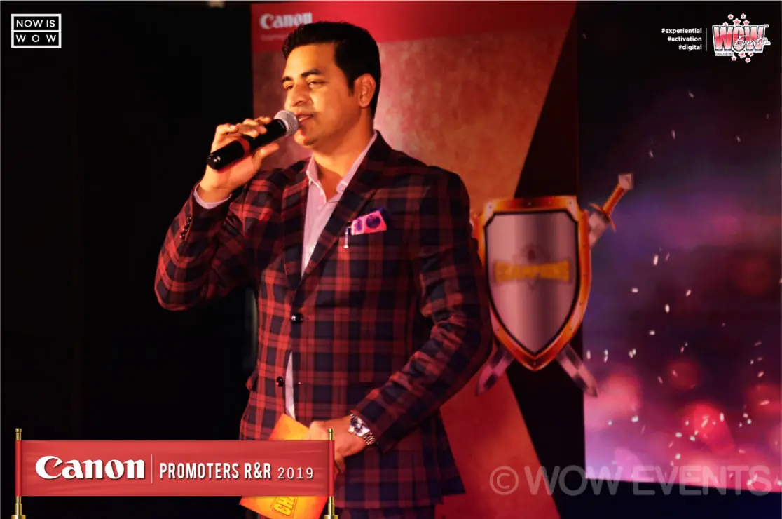 Singer with a microphone on the Canon promoters stage