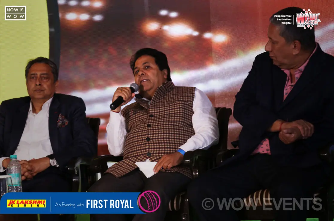 Panel seated on stage with microphones at the Shane Warne evening