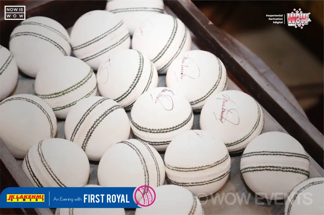 Pile of white cricket balls