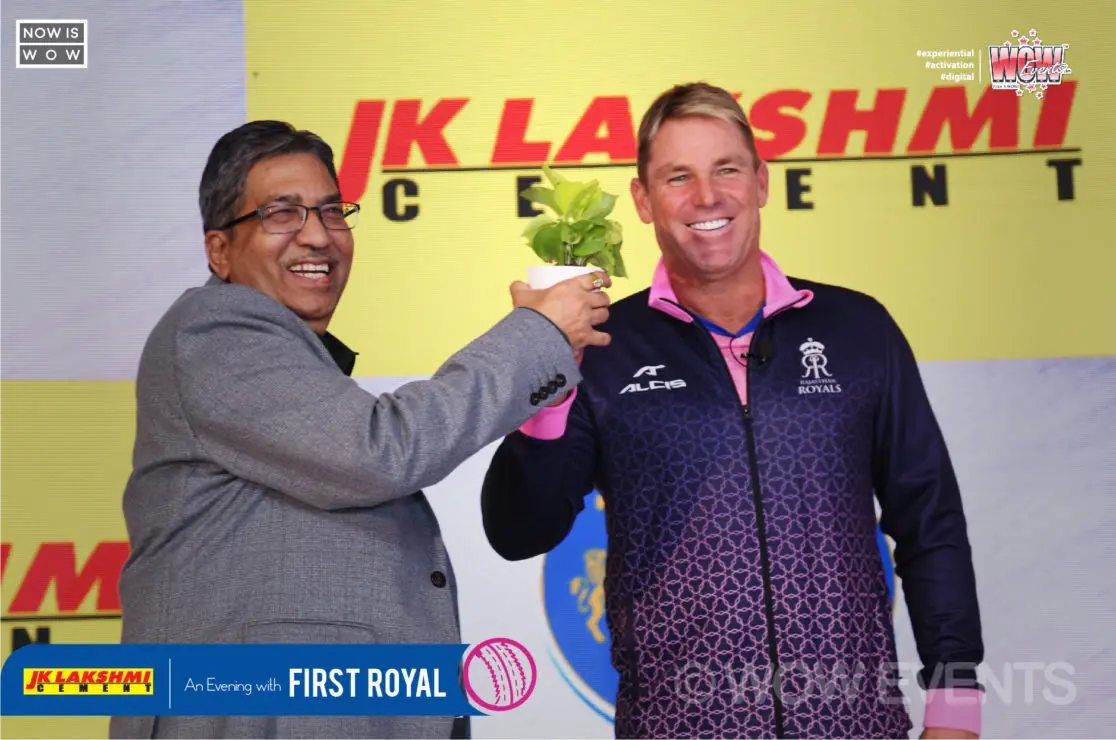 JK Lakshmi Cement executive with Shane Warne on stage