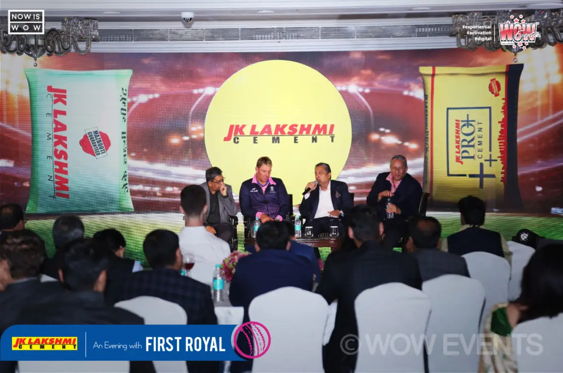 JK Lakshmi Cement stage with seated guests at the Shane Warne evening