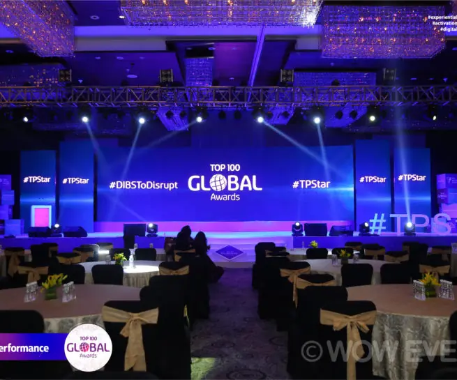 Teleperformance Top 100 Global Awards hall lit in blue