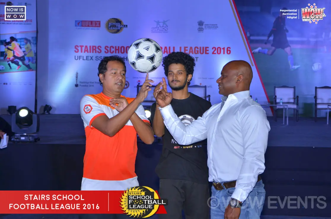Guests launching a football on the Stairs School Football League stage