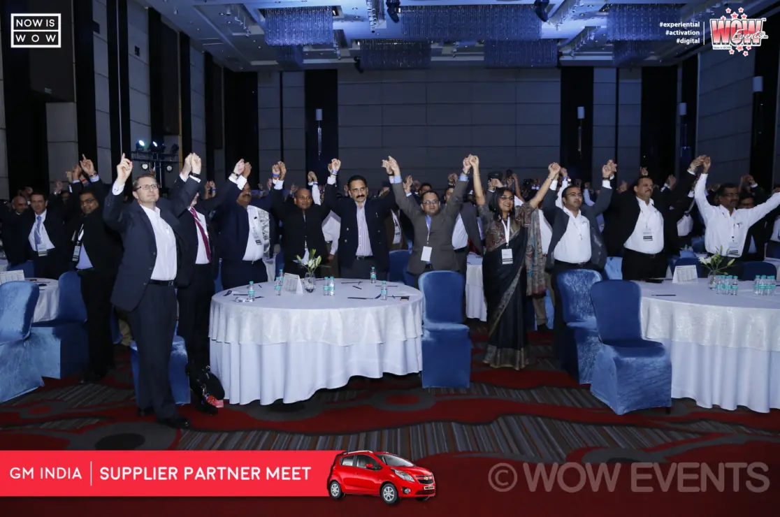 GM India supplier partner meet attendees group photo on stage