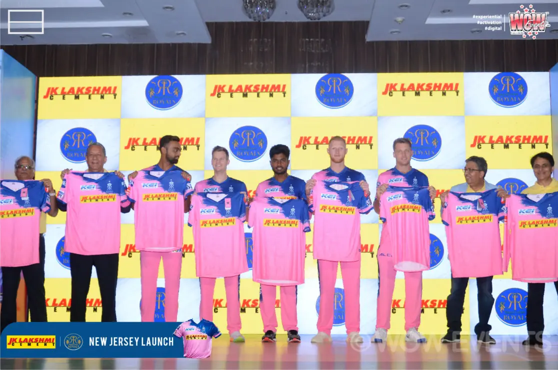 Rajasthan Royals players in pink jerseys lined up on stage