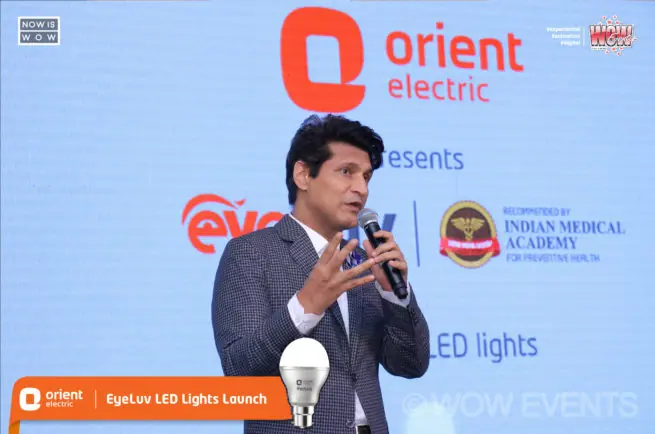 Speaker with a microphone at the Orient Electric Eyeluv LED launch