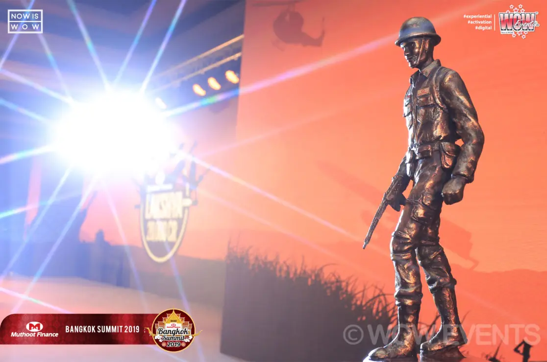 Soldier statue on stage under a spotlight
