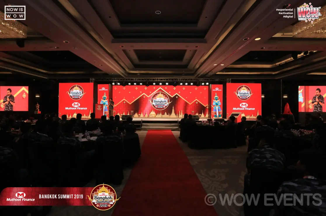 Banquet hall with a red carpet at the Muthoot Finance summit