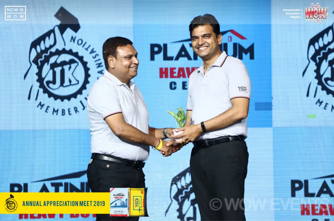 Dealer receiving an award from a JK Lakshmi Cement executive