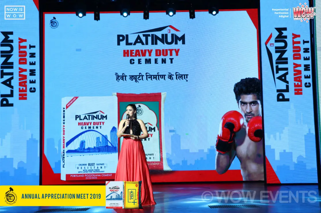 Host on stage with the Platinum Heavy Duty Cement screen