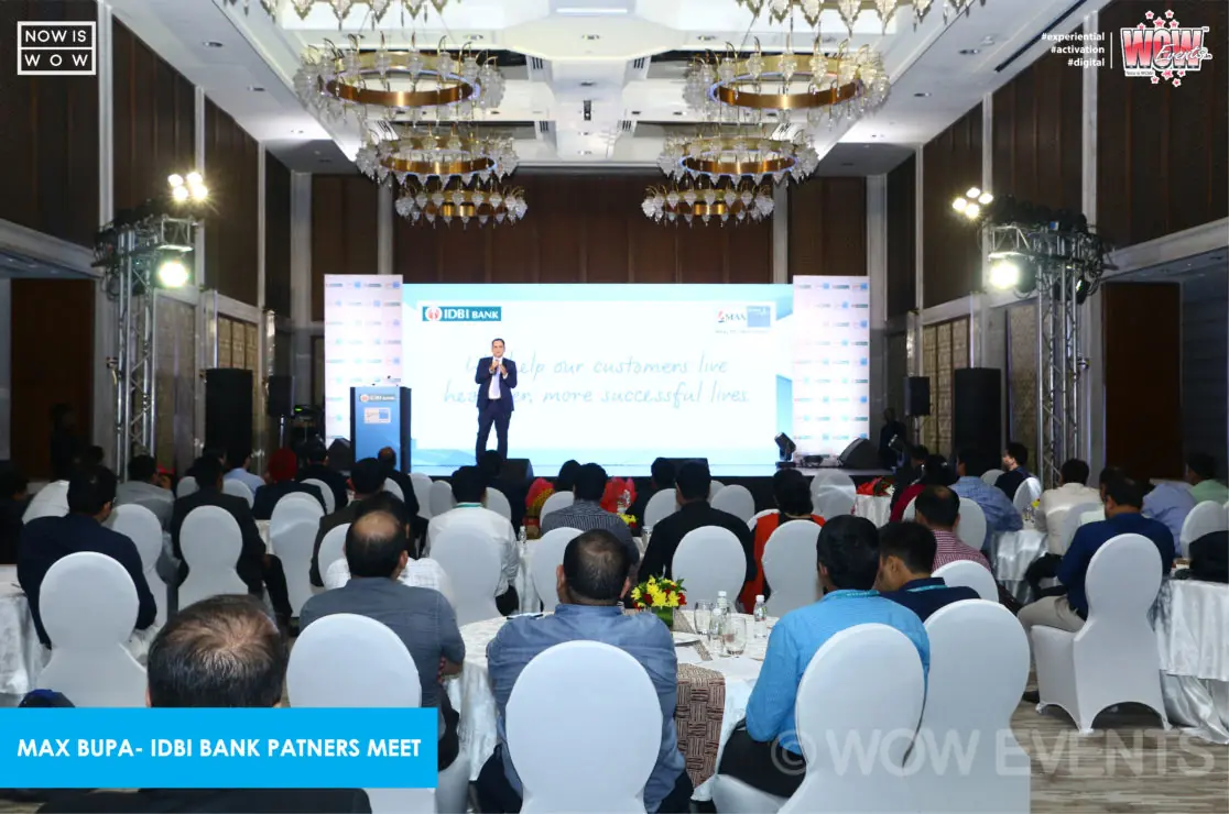 Ballroom full of attendees facing the stage