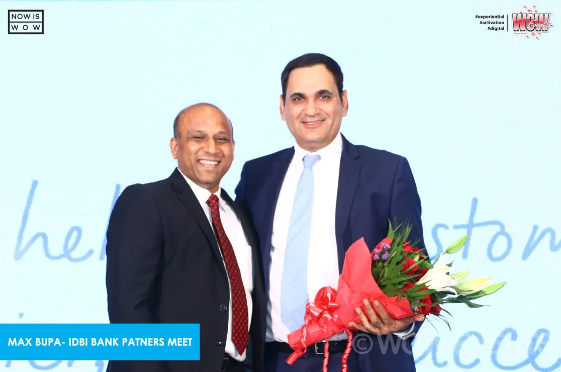 Executive receiving a bouquet at the partners meet