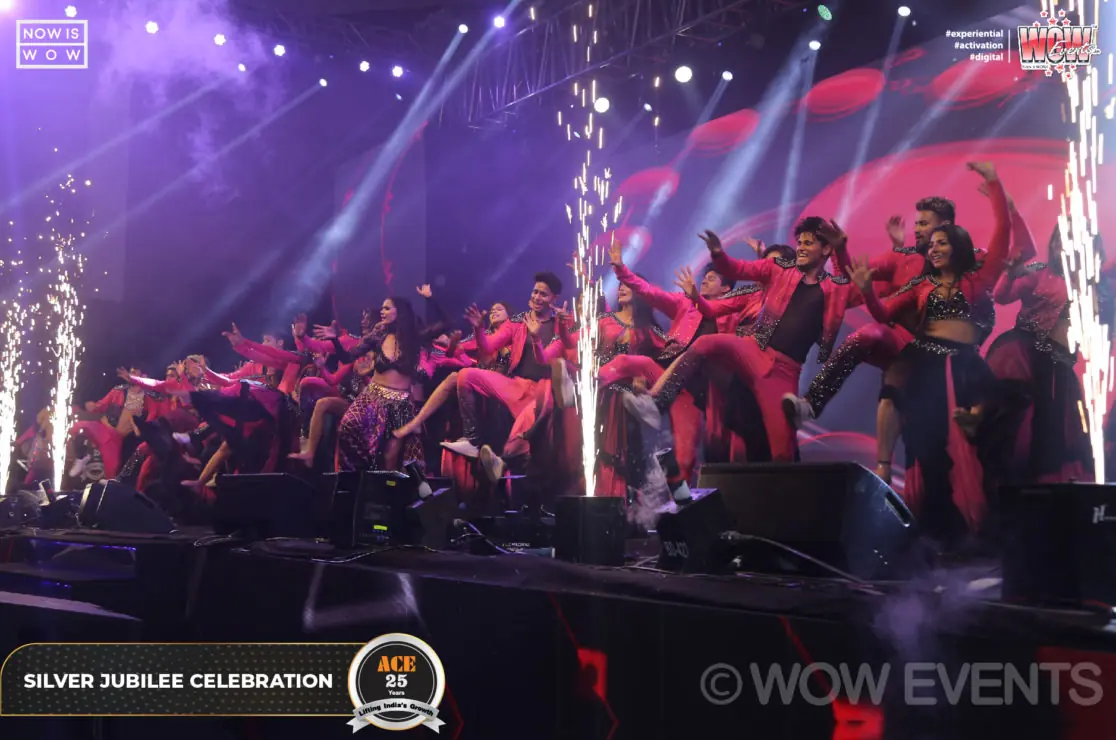 Dancers performing with sparkler effects at the ACE celebration