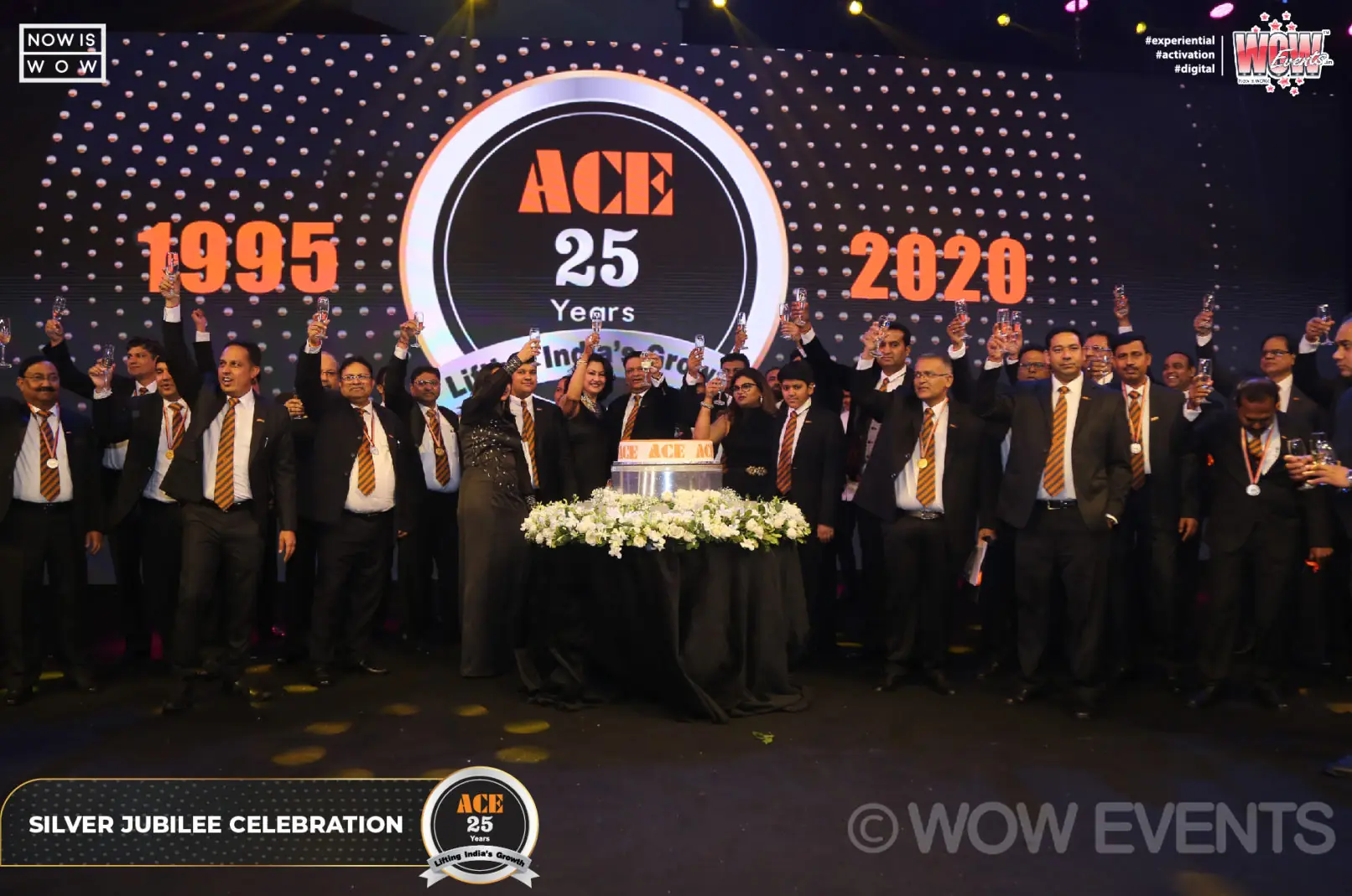 ACE executives on stage with the 1995 to 2020 25 years backdrop