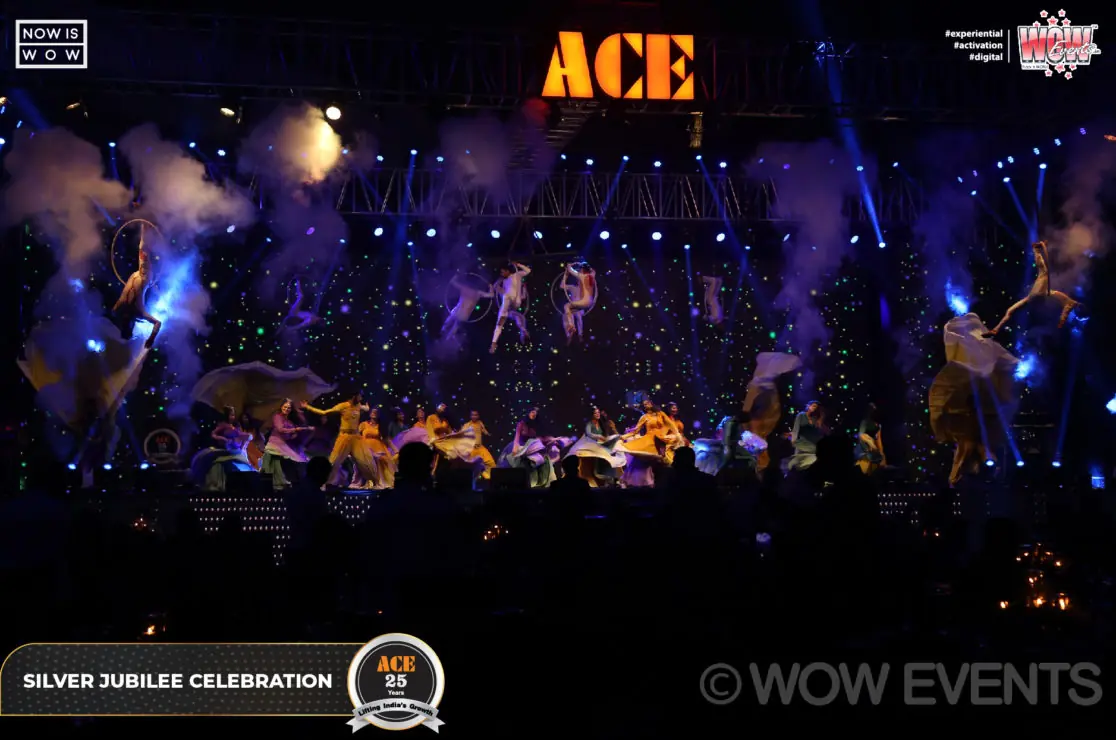 ACE silver jubilee crowd under a lit ACE sign