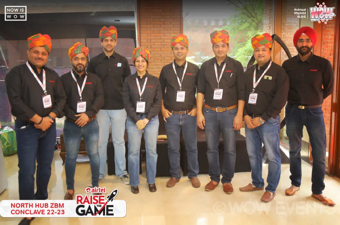 Airtel team wearing orange turbans group photo