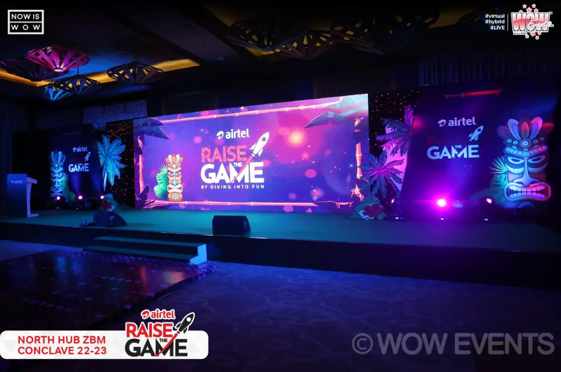 Raise the Game stage lit in blue and purple