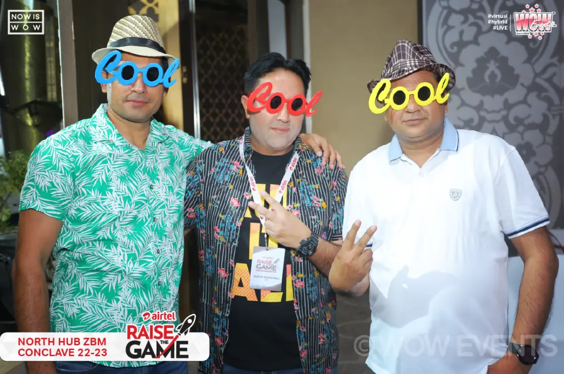 Guests posing with fun photo booth props