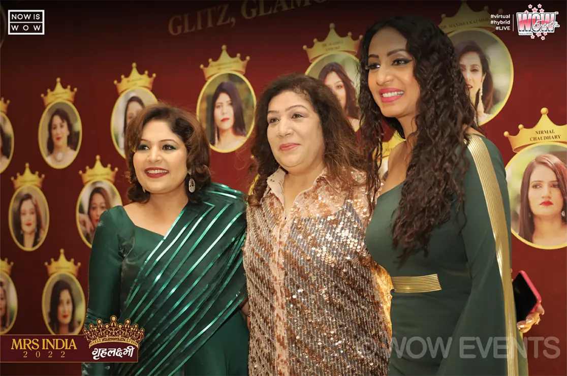 Three women posing at the Grehlakshmi Mrs India 2022 photo wall