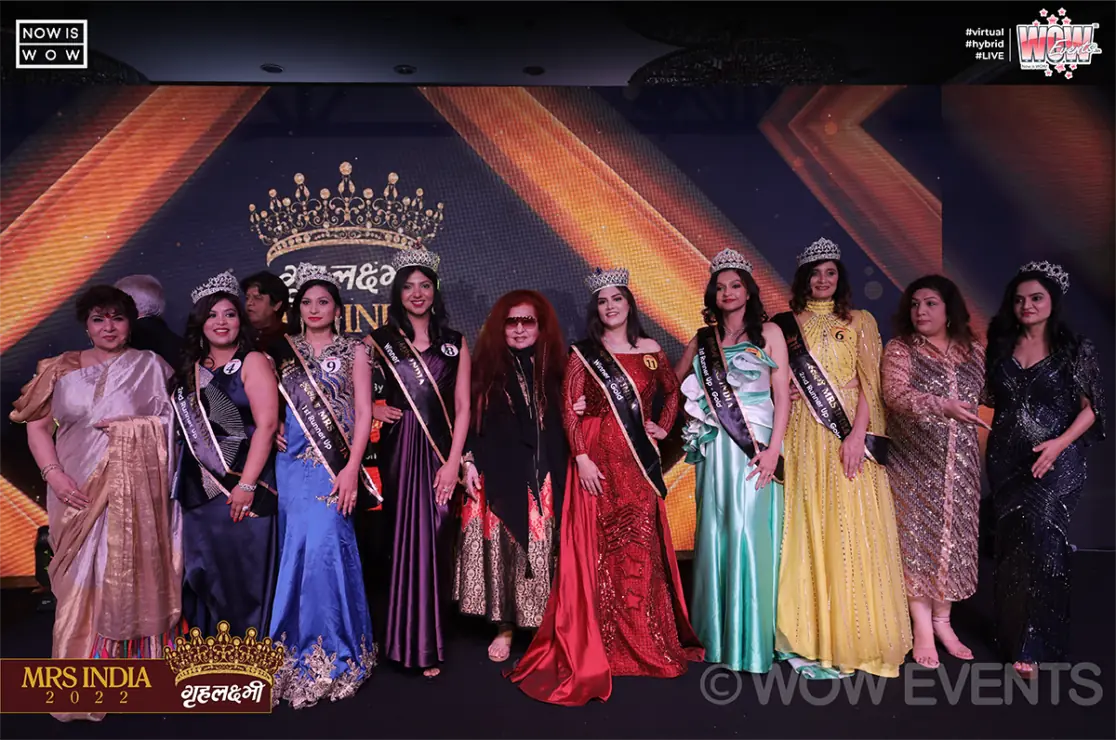 Sash-wearing finalists lined up on stage at Grehlakshmi Mrs India 2022