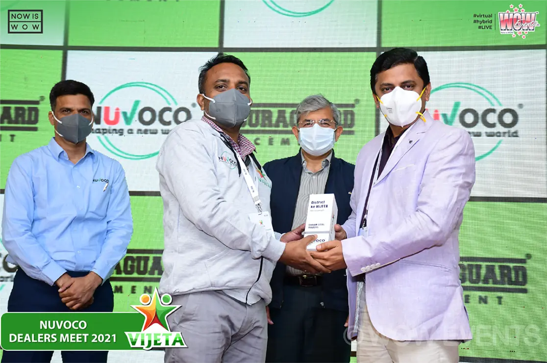 Nuvoco executives presenting an award to a dealer