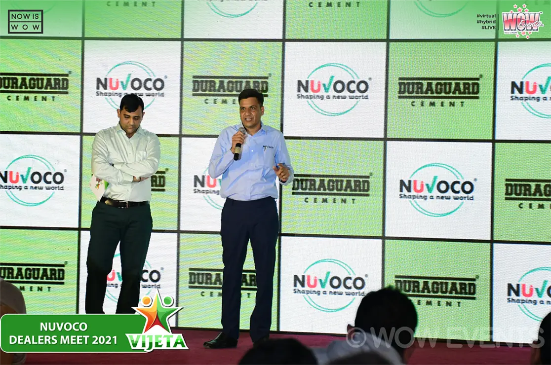 Nuvoco executives posing in front of the Duraguard backdrop